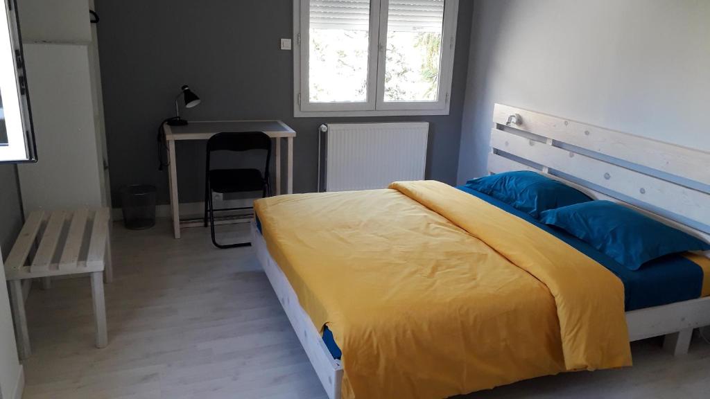 Postel nebo postele na pokoji v ubytování Chez Madgi et Jean-Mi