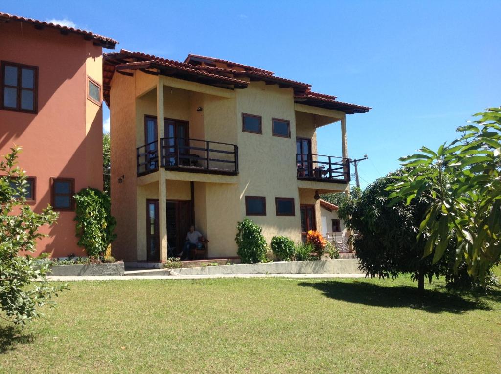 a large house with a lawn in front of it at Pousada Shamballa in Sao Jorge