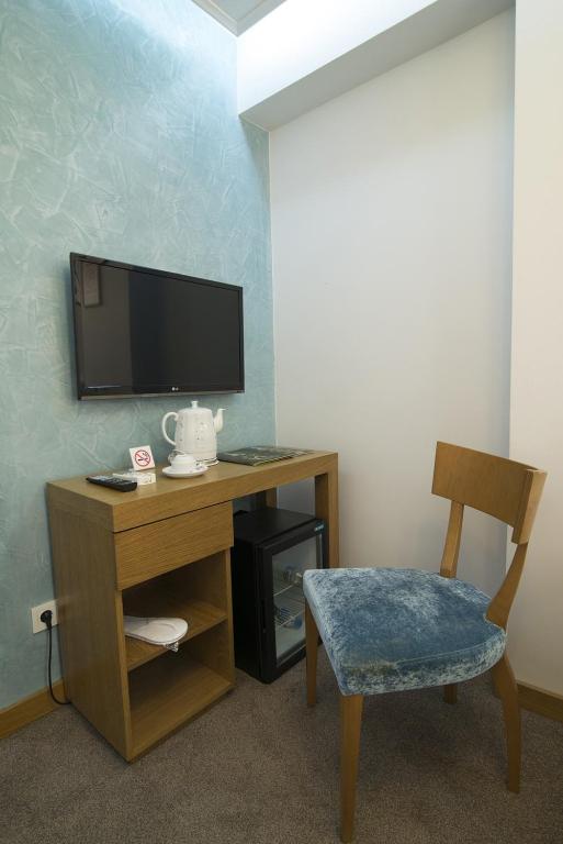 TV a/nebo společenská místnost v ubytování Cumbali Suite Hotel