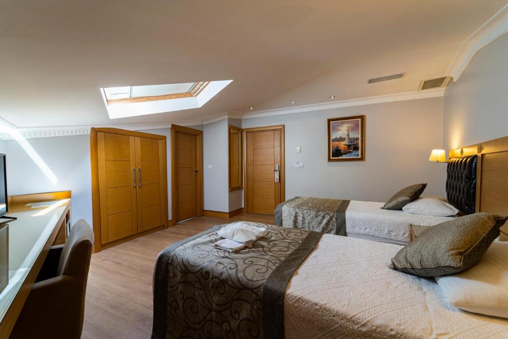 Postel nebo postele na pokoji v ubytování Levent Hotel Istanbul