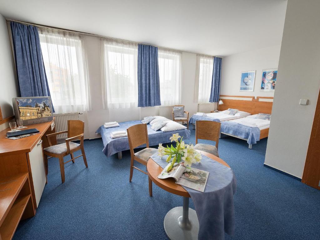 Postel nebo postele na pokoji v ubytování EA Hotel Populus