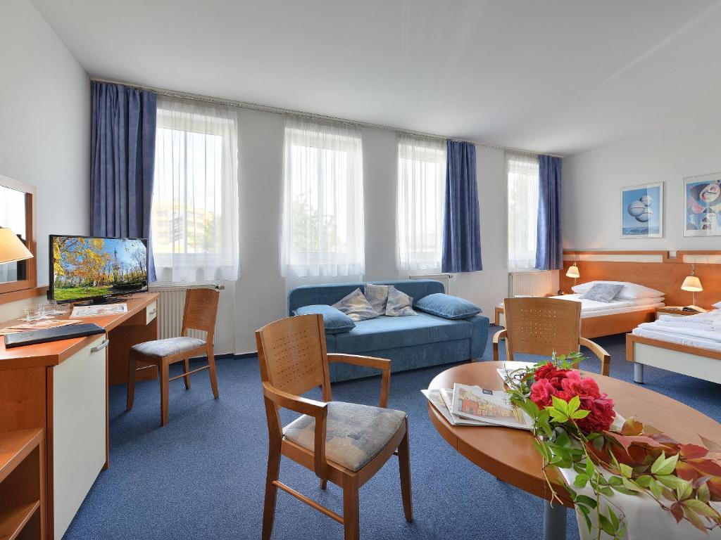 Postel nebo postele na pokoji v ubytování EA Hotel Populus