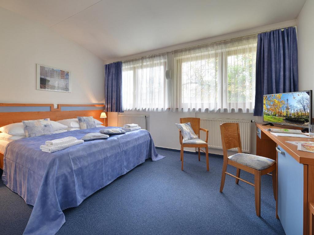 Postel nebo postele na pokoji v ubytování EA Hotel Populus