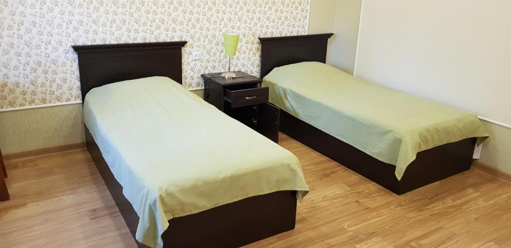 Voodi või voodid majutusasutuse Ruzan hotel toas