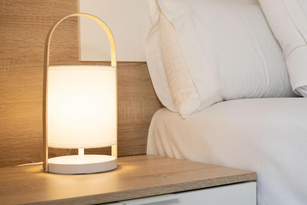 Posteľ alebo postele v izbe v ubytovaní Feelathome Center Apartments