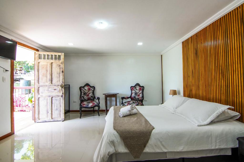 Postel nebo postele na pokoji v ubytování Finca Hotel Yerbabuena