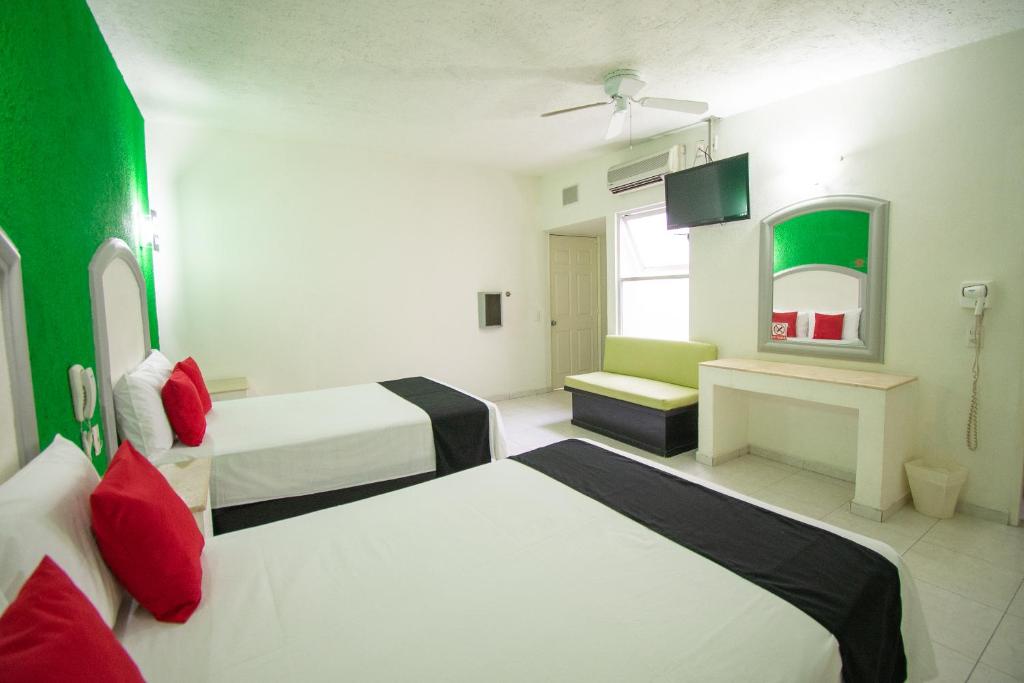 Postel nebo postele na pokoji v ubytování Hotel Rivoli