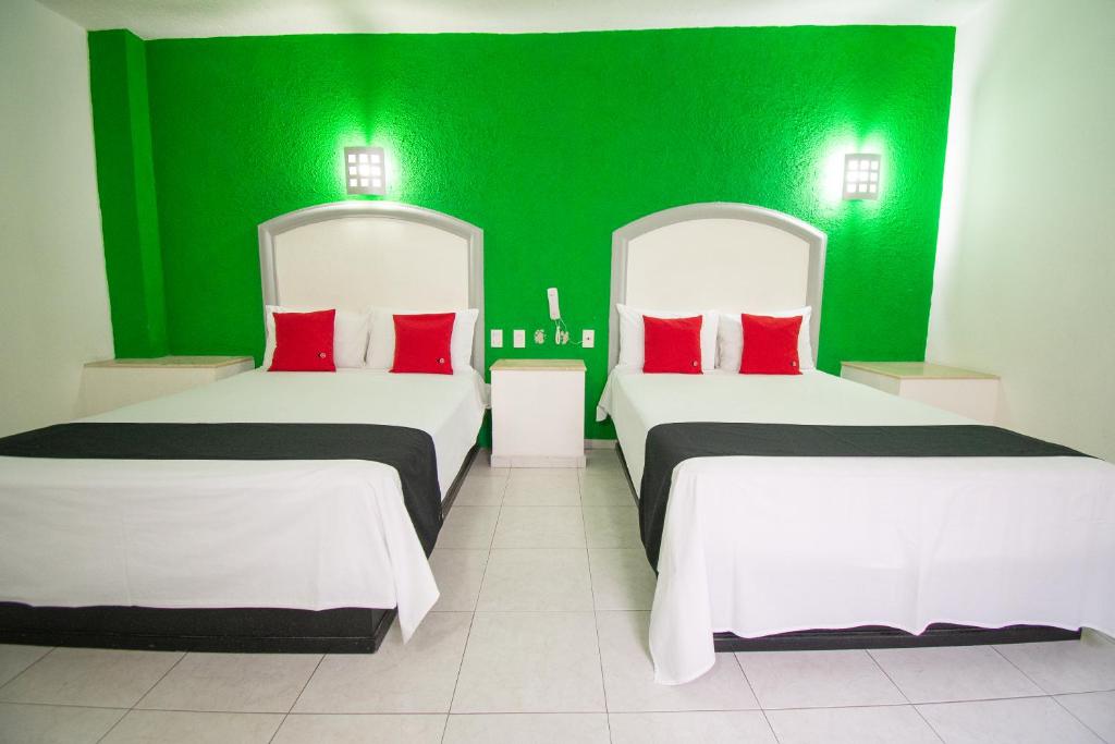 Postel nebo postele na pokoji v ubytování Hotel Rivoli
