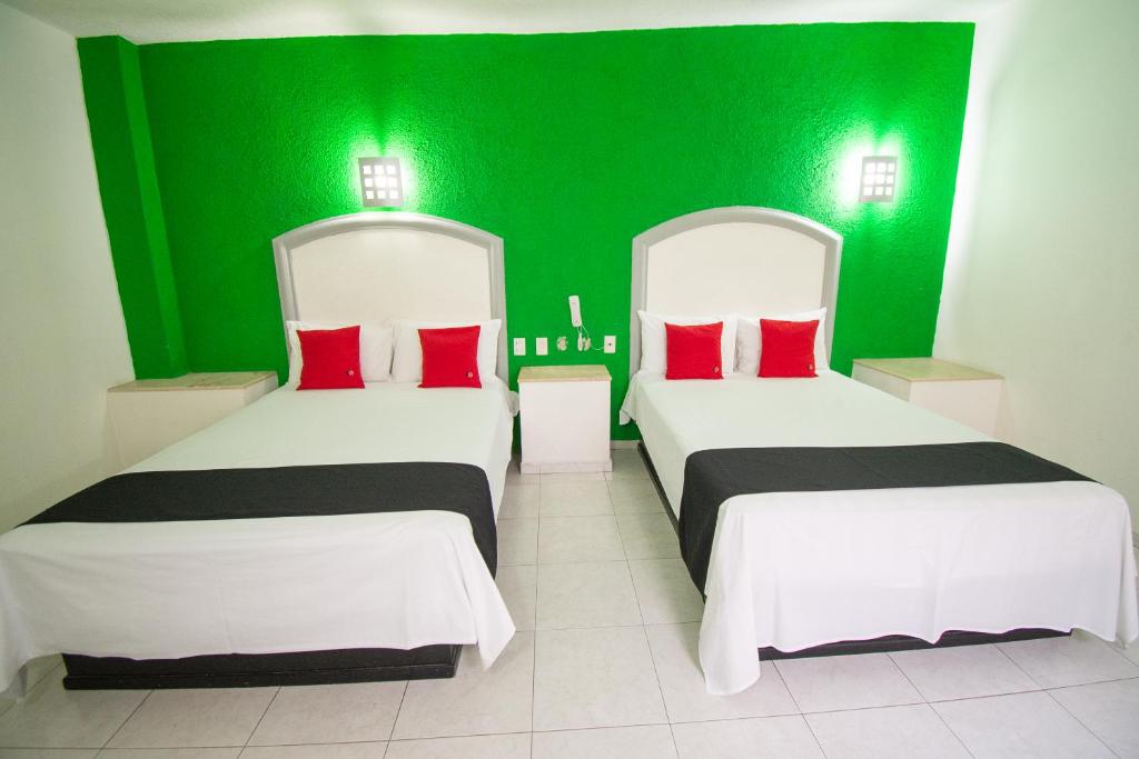 Postel nebo postele na pokoji v ubytování Hotel Rivoli