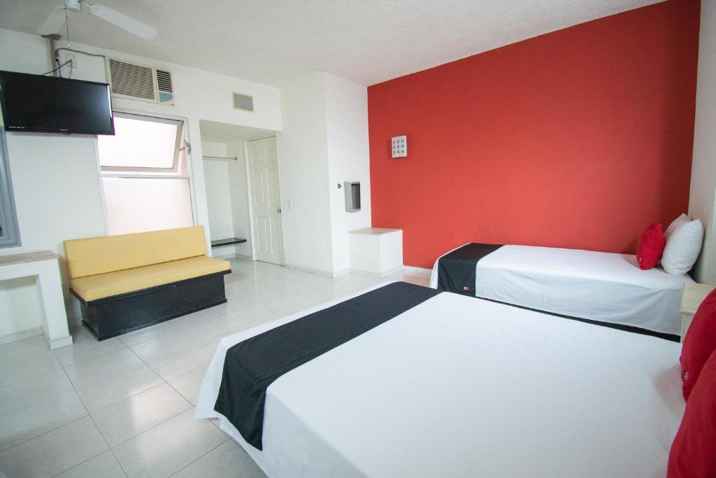 Postel nebo postele na pokoji v ubytování Hotel Rivoli