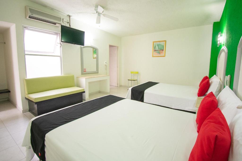 Postel nebo postele na pokoji v ubytování Hotel Rivoli