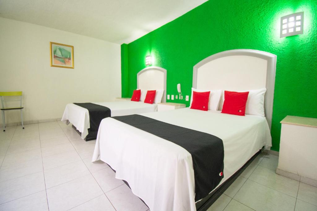 Postel nebo postele na pokoji v ubytování Hotel Rivoli