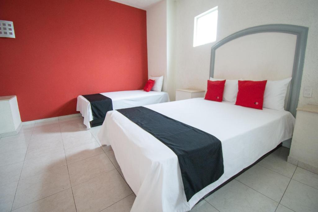 Postel nebo postele na pokoji v ubytování Hotel Rivoli