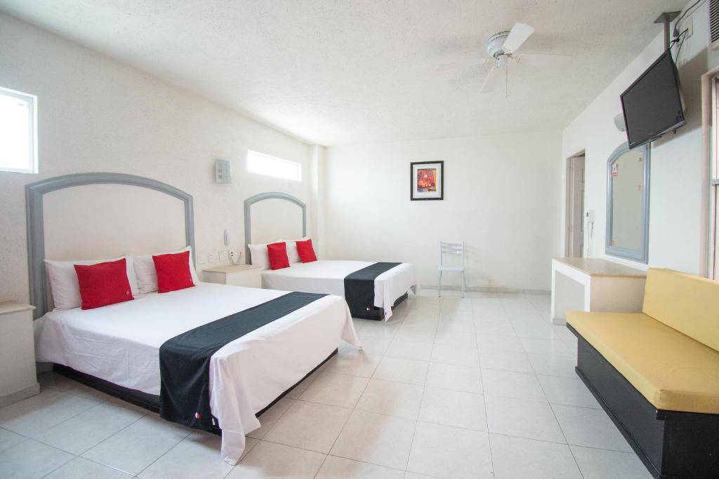 Postel nebo postele na pokoji v ubytování Hotel Rivoli