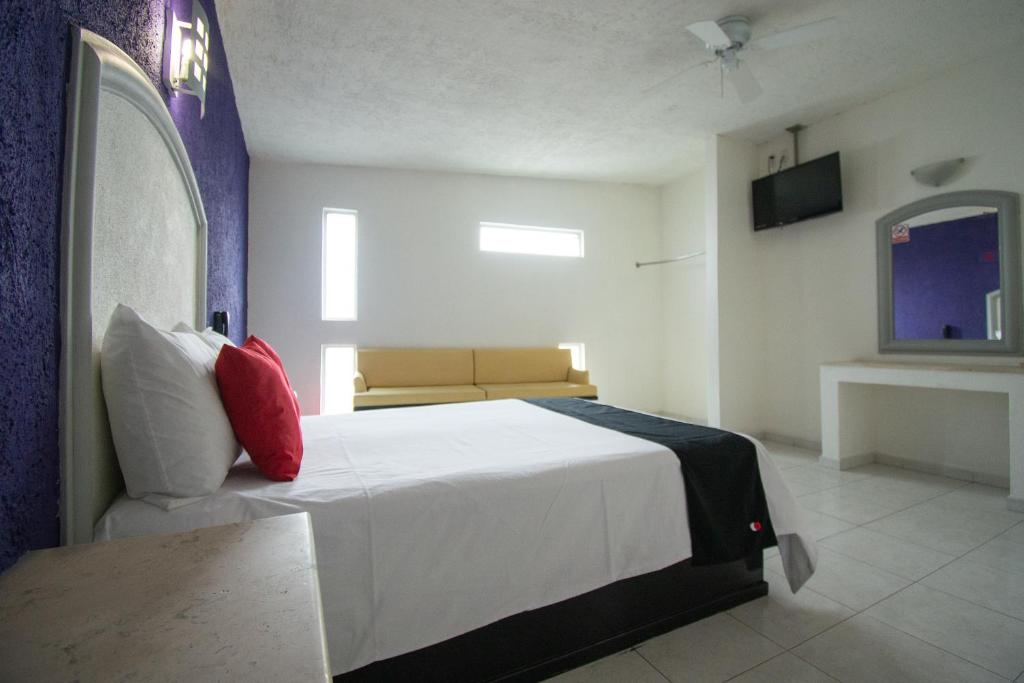 Postel nebo postele na pokoji v ubytování Hotel Rivoli
