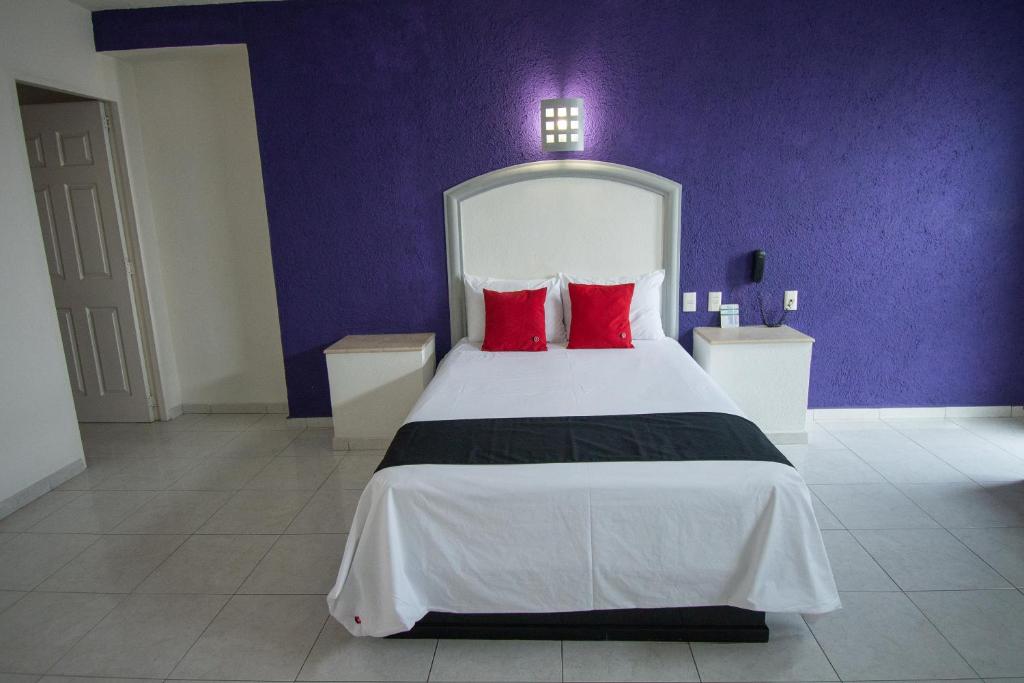 Postel nebo postele na pokoji v ubytování Hotel Rivoli