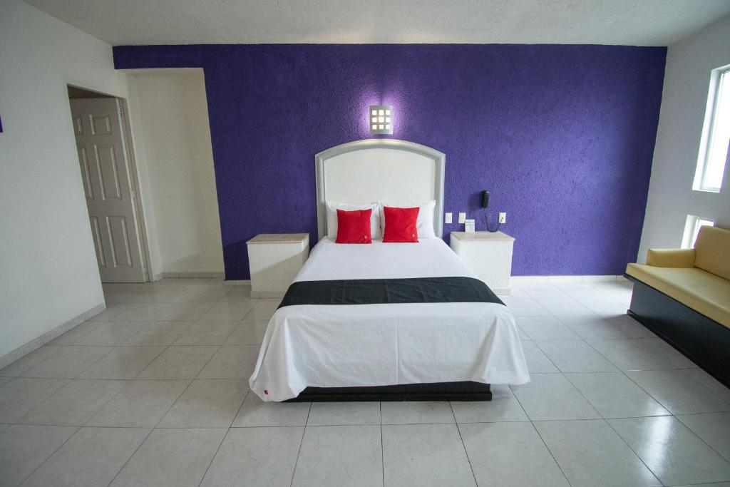 Postel nebo postele na pokoji v ubytování Hotel Rivoli
