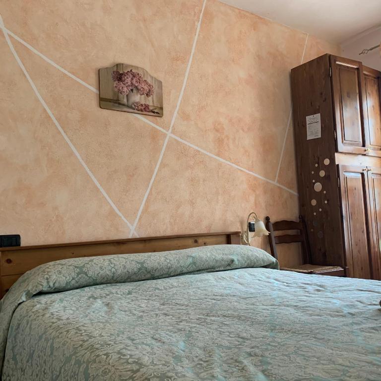 Postel nebo postele na pokoji v ubytování Residence il Varco del Pollino