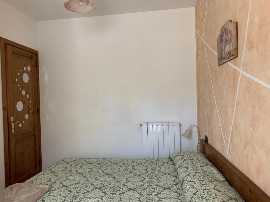 Postel nebo postele na pokoji v ubytování Residence il Varco del Pollino