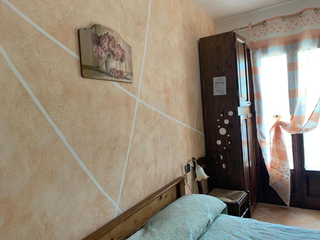 Postel nebo postele na pokoji v ubytování Residence il Varco del Pollino