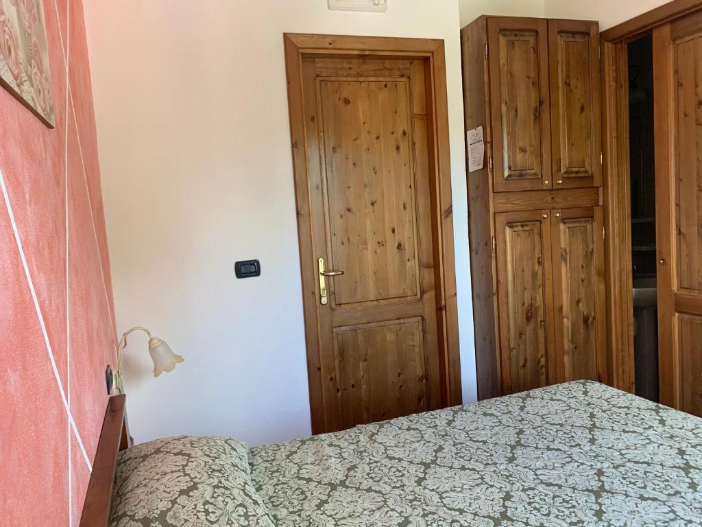 Postel nebo postele na pokoji v ubytování Residence il Varco del Pollino