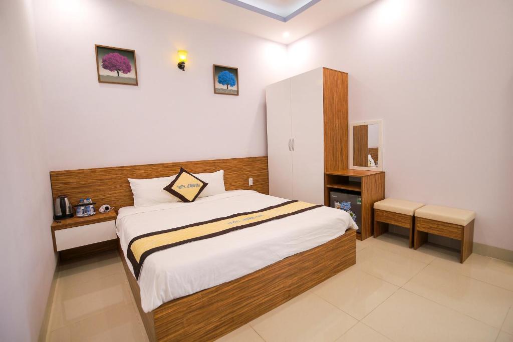 Postel nebo postele na pokoji v ubytování Hotel Hương Đào