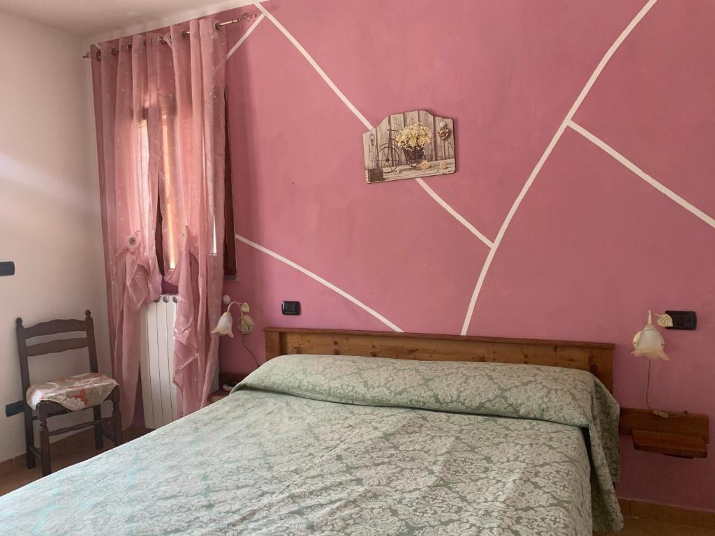 Postel nebo postele na pokoji v ubytování Residence il Varco del Pollino