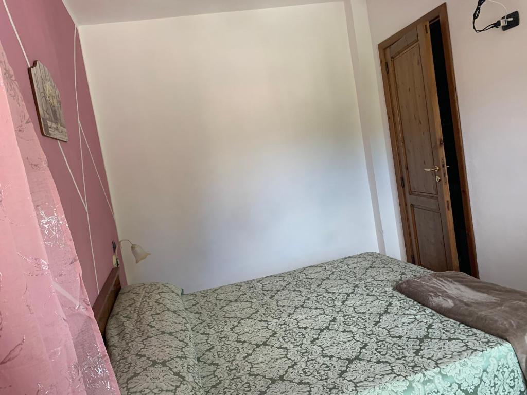 Postel nebo postele na pokoji v ubytování Residence il Varco del Pollino
