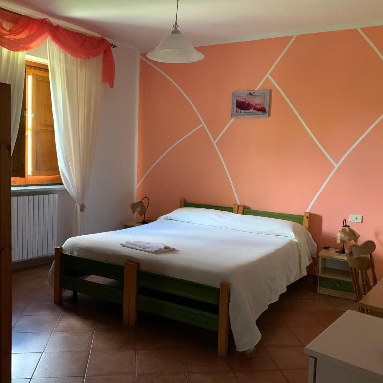 Postel nebo postele na pokoji v ubytování Residence il Varco del Pollino
