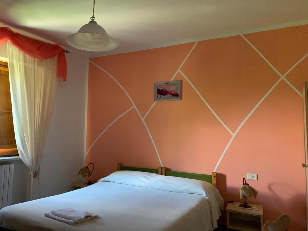 Postel nebo postele na pokoji v ubytování Residence il Varco del Pollino