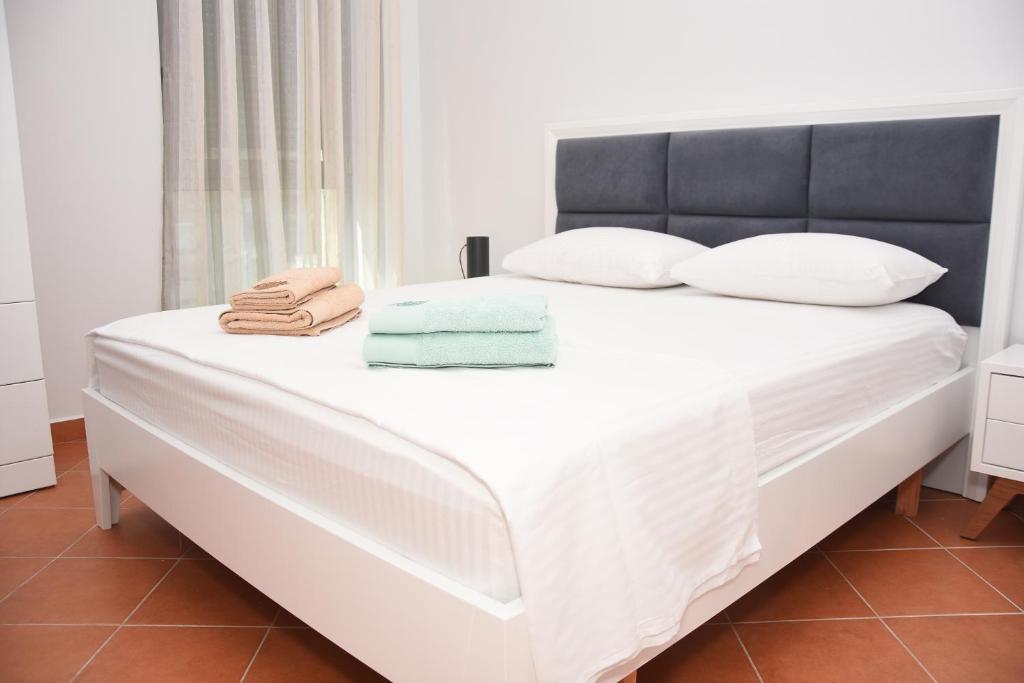 Krevet ili kreveti u jedinici u okviru objekta Click Apartments - Tirana