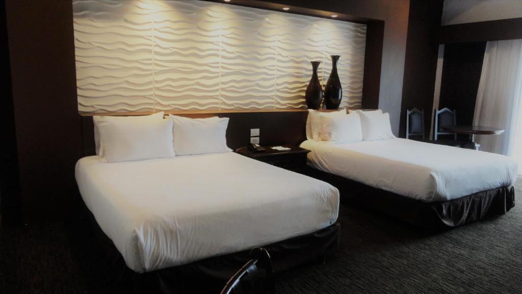 Postel nebo postele na pokoji v ubytování Radisson Hotel Tapatio Guadalajara Aeropuerto