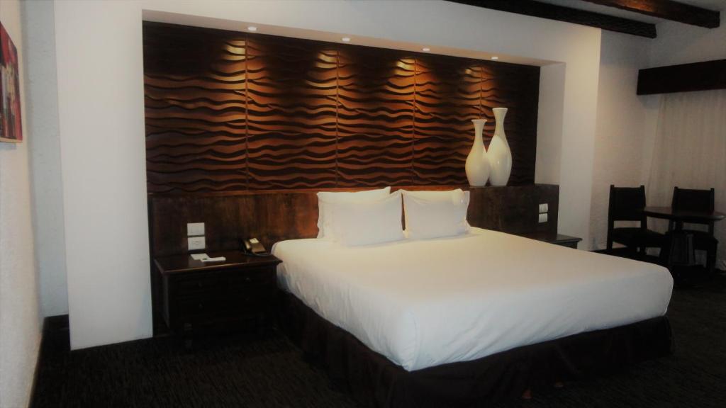 Postel nebo postele na pokoji v ubytování Radisson Hotel Tapatio Guadalajara Aeropuerto
