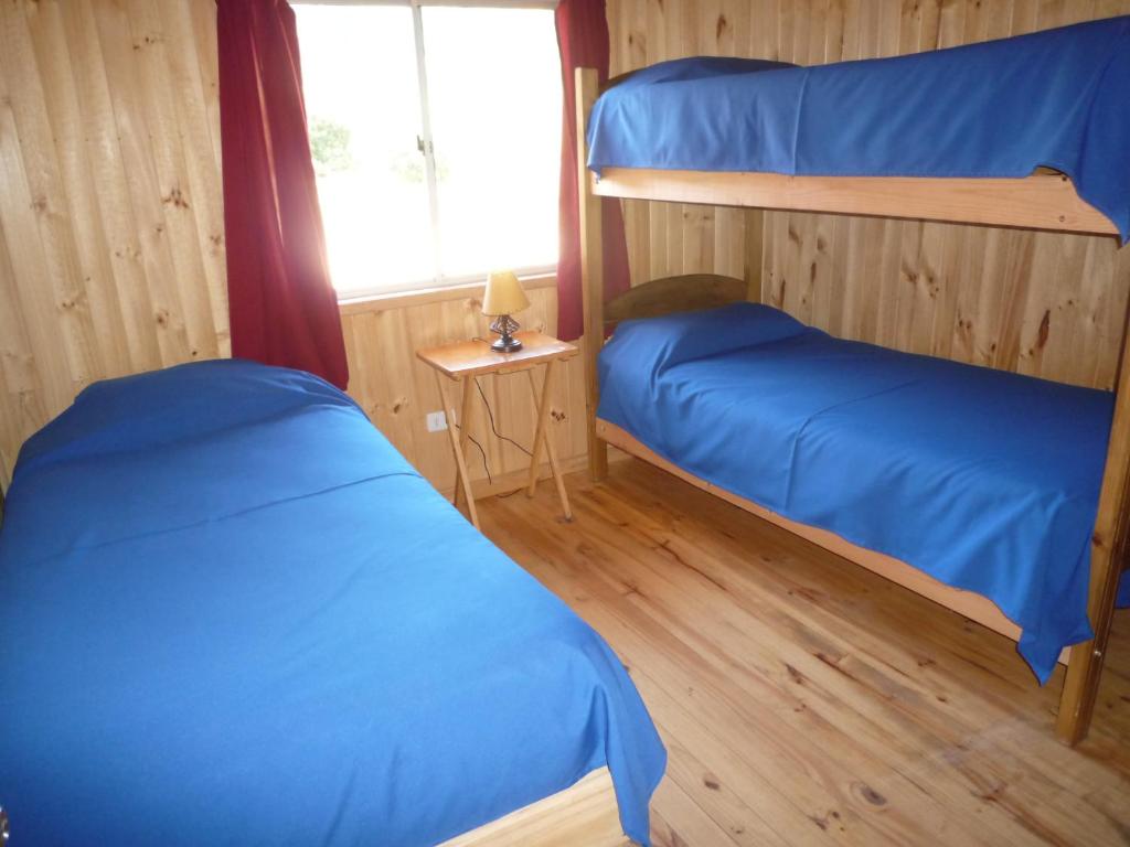 Postel nebo postele na pokoji v ubytování Cabañas Campomar