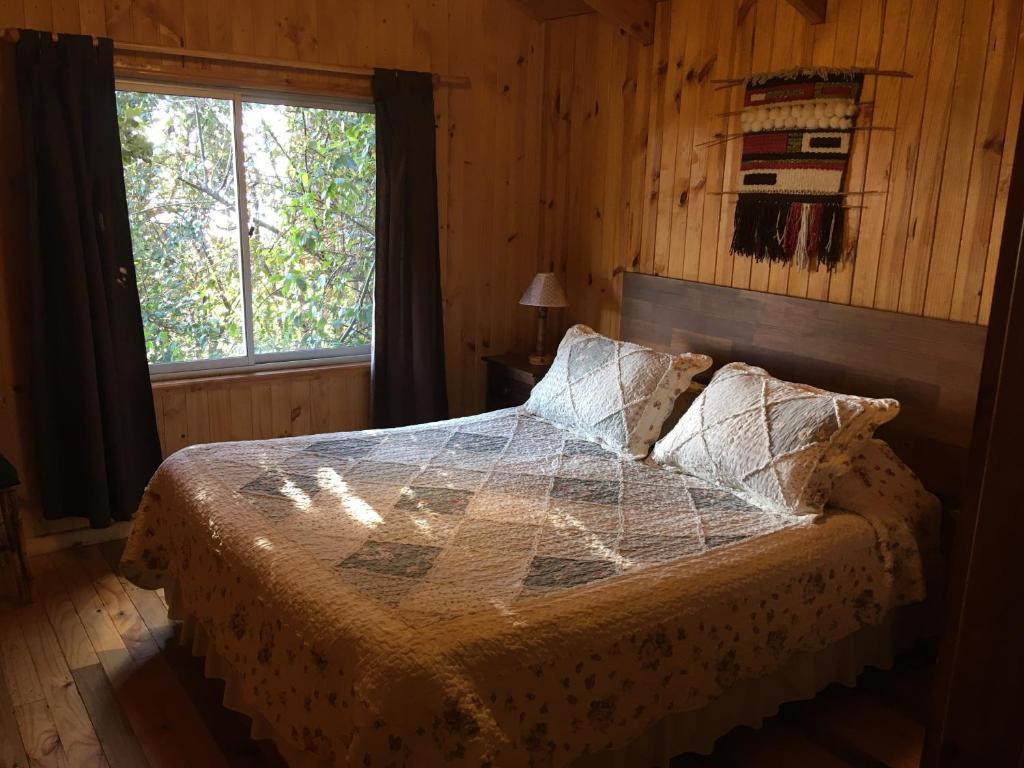 Postel nebo postele na pokoji v ubytování Cabañas Campomar
