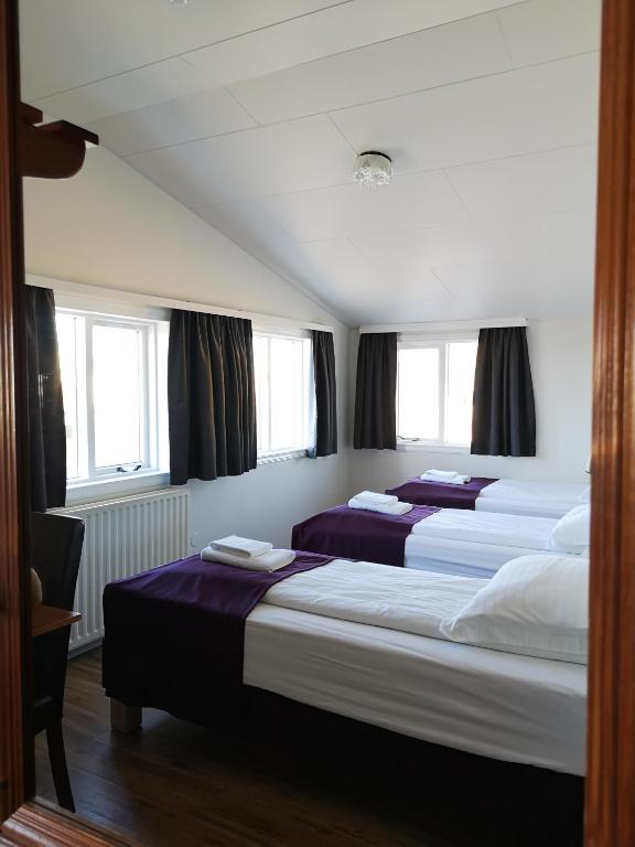 Postel nebo postele na pokoji v ubytování The Vík Inn by Ourhotels