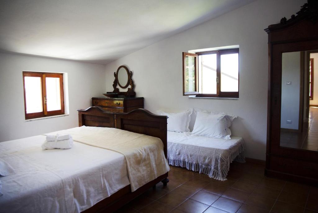 A bed or beds in a room at Nonna Maria