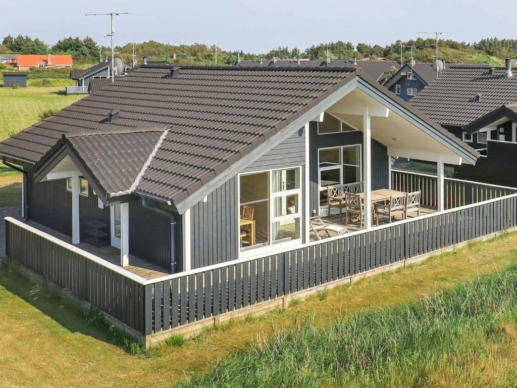 an overhead view of a house with a roof at 6 person holiday home in Ringk bing in Nørby