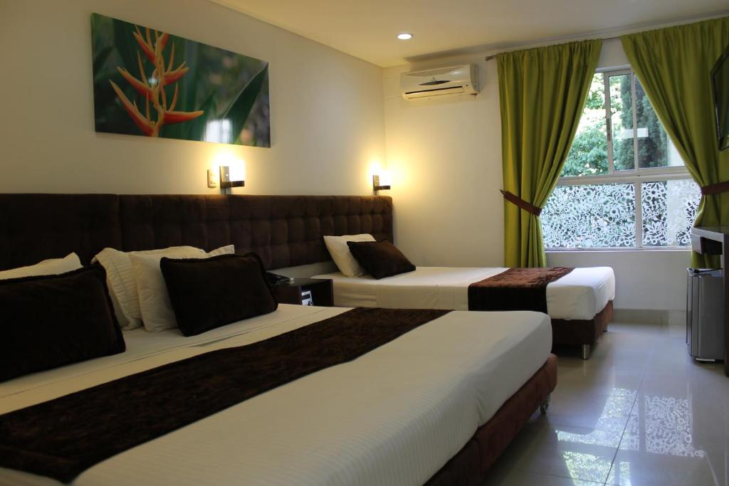 Uma cama ou camas num quarto em Hotel Boutique las Rosas 5 G