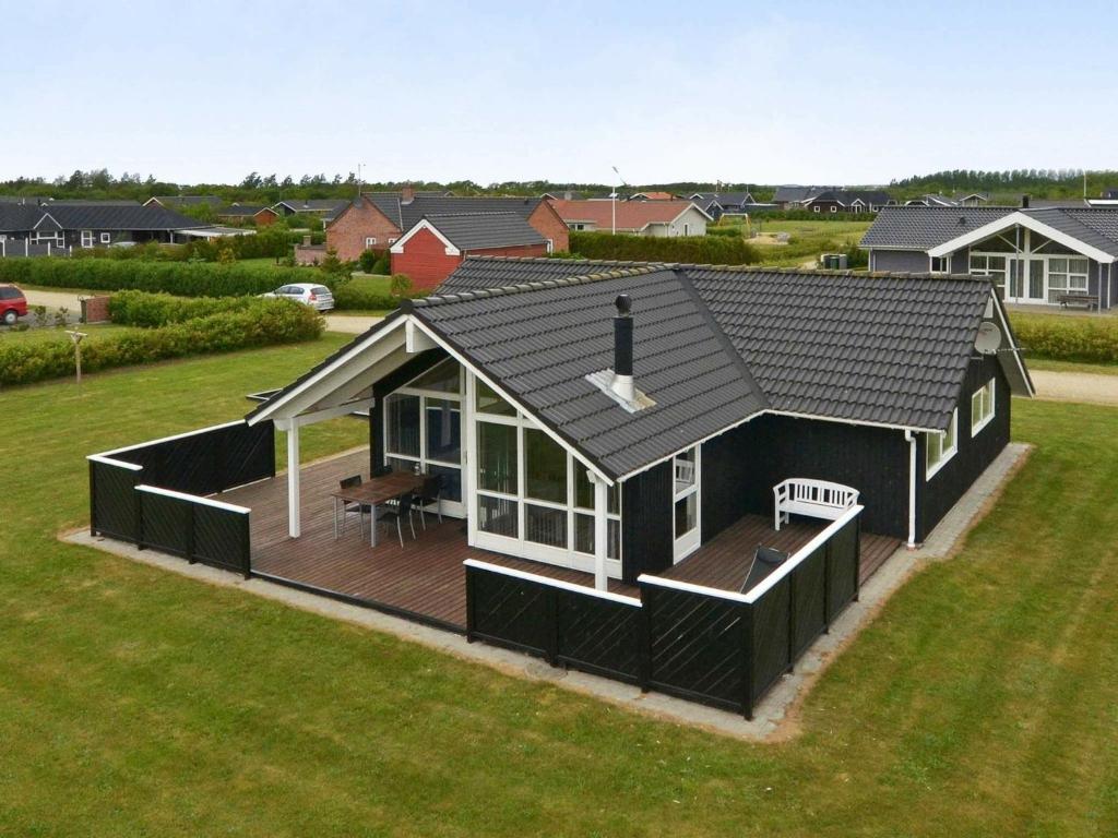 an overhead view of a black house with a deck at 6 person holiday home in Tarm in Hemmet
