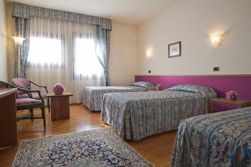 Postel nebo postele na pokoji v ubytování Hotel Spresiano