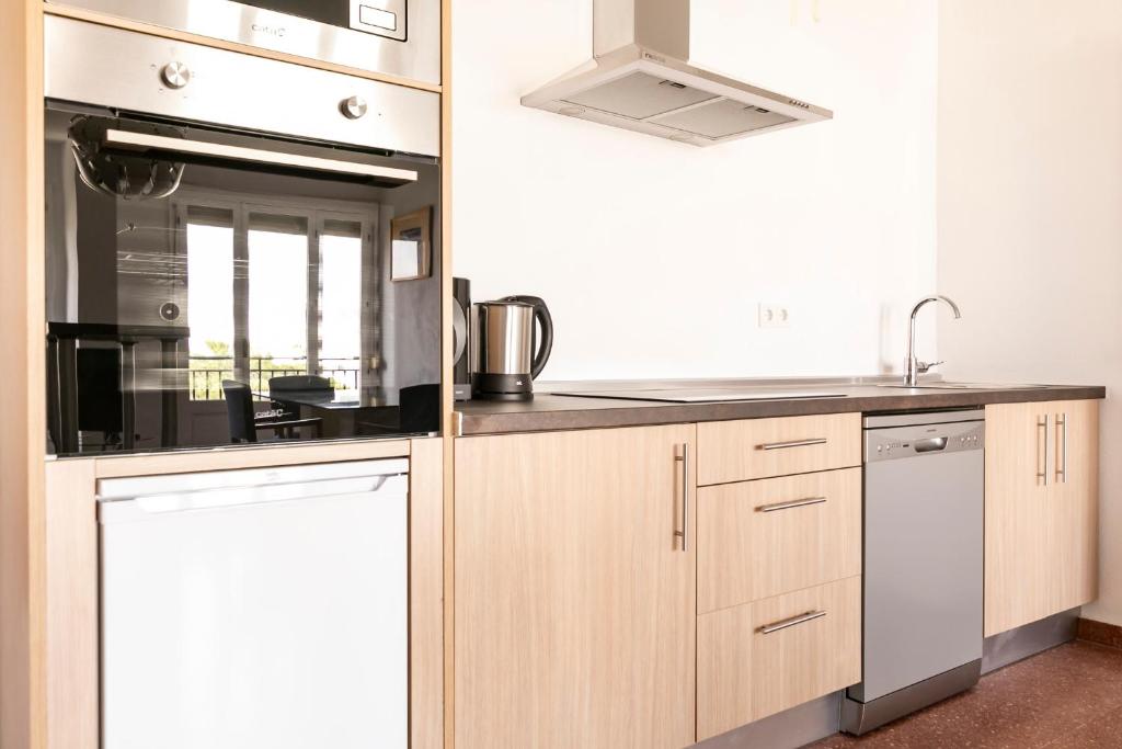 Kuchyňa alebo kuchynka v ubytovaní Alameda Principal FreshApartments