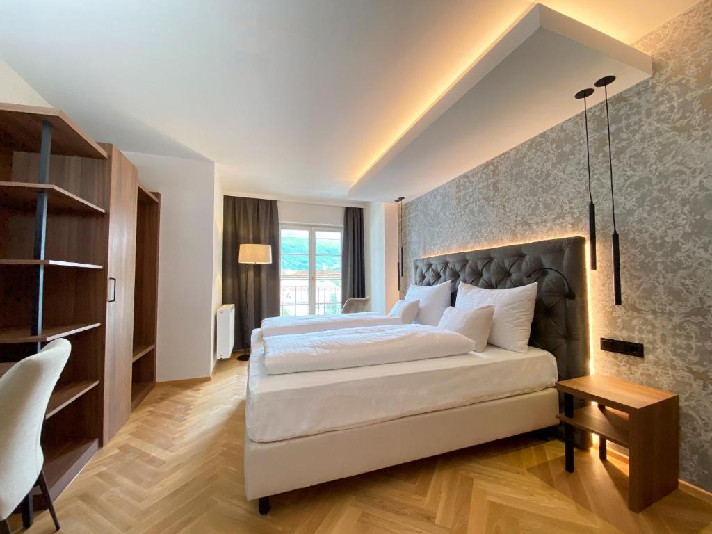 Posteľ alebo postele v izbe v ubytovaní Hotel Schwarzer Adler Innsbruck