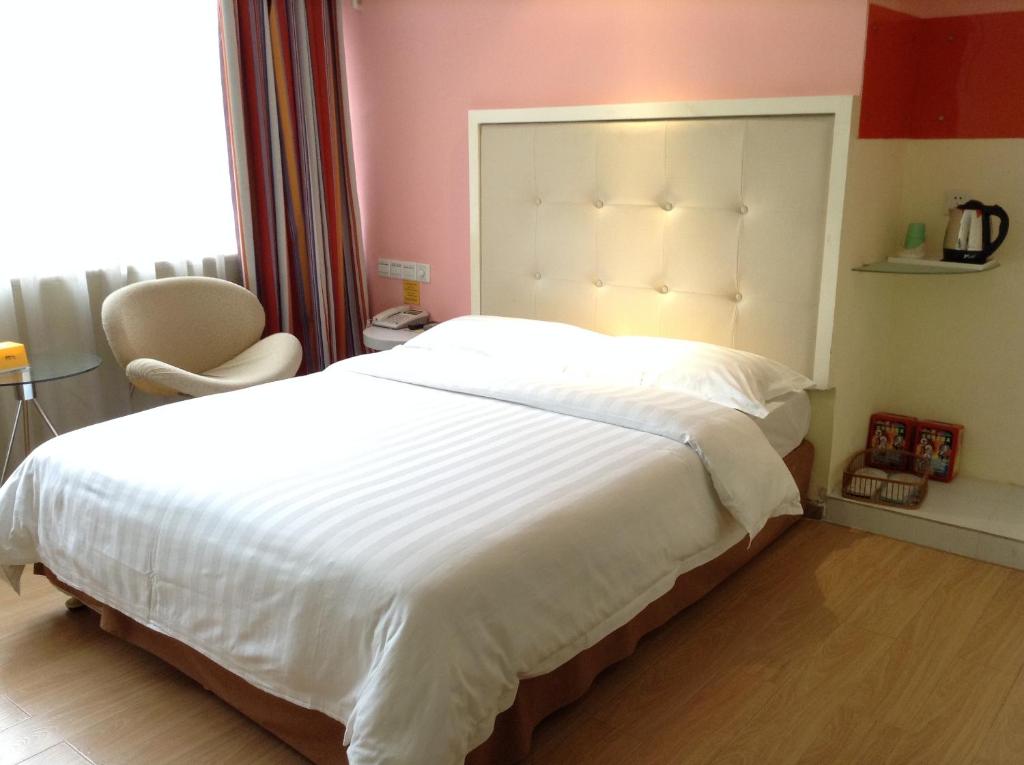 Postel nebo postele na pokoji v ubytování Shenzhen Green Oasis Hotel, Baoan