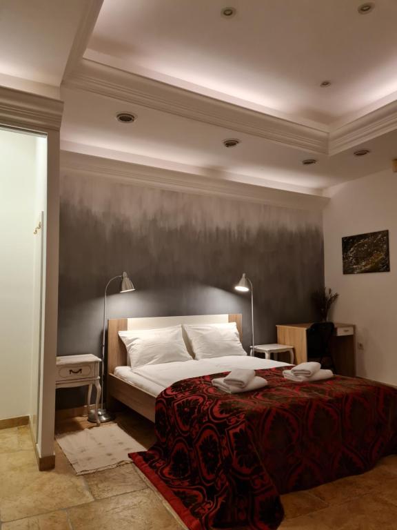 Posteľ alebo postele v izbe v ubytovaní Apartmani N.May's