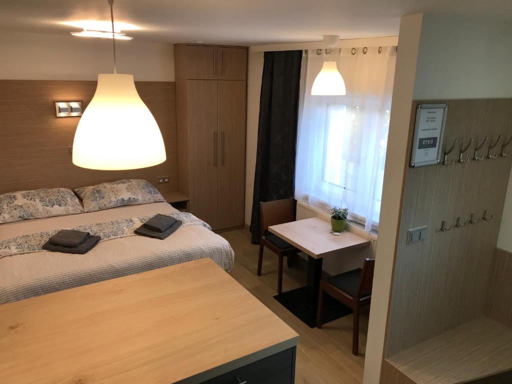 Postel nebo postele na pokoji v ubytování Penzion Hornička
