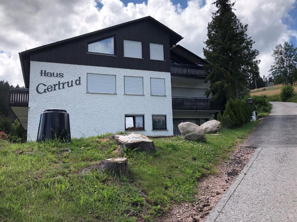 a building with a sign that reads has centaurus at Haus Gertrud in Schönwald