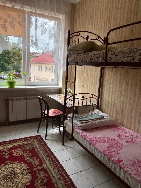Postel nebo postele na pokoji v ubytování Centre Hostel