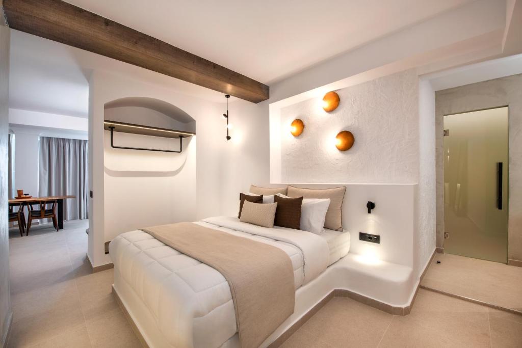 Postel nebo postele na pokoji v ubytování Gonia Residences