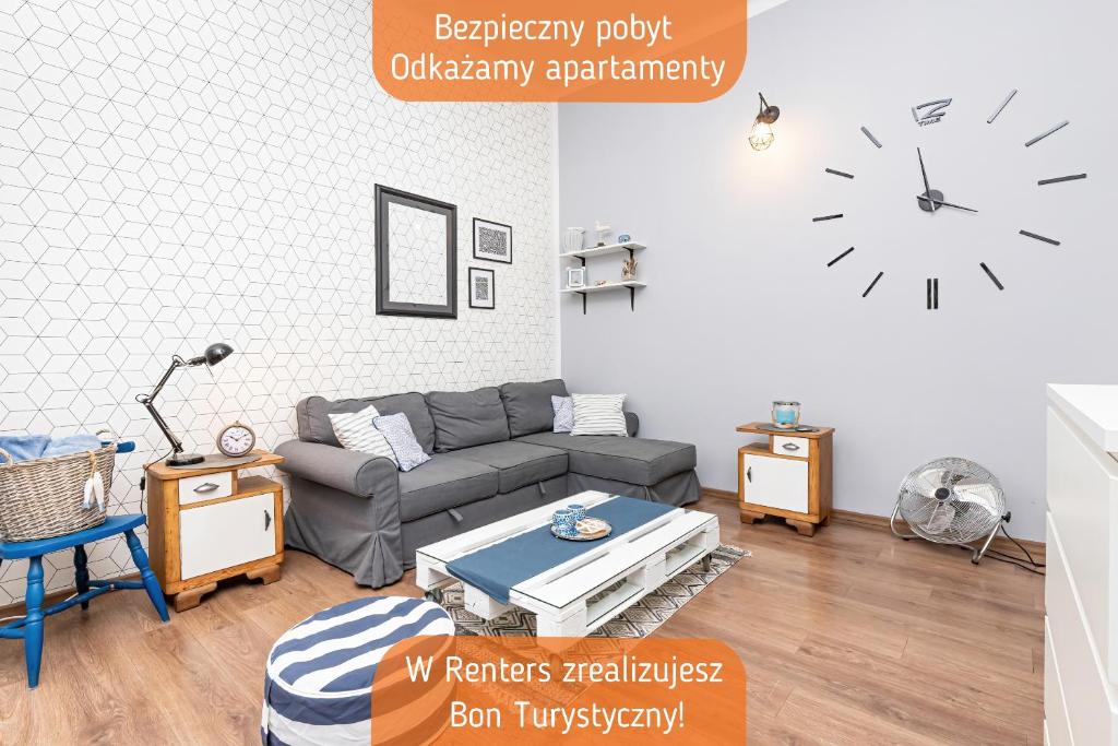 Część wypoczynkowa w obiekcie Apartment PortLove Gdynia by Renters
